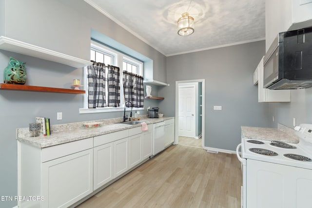 kitchen featuring white appliances, a sink, ornamental molding, open shelves, and light wood finished floors