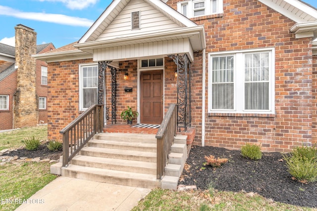 bungalow-style house featuring brick siding