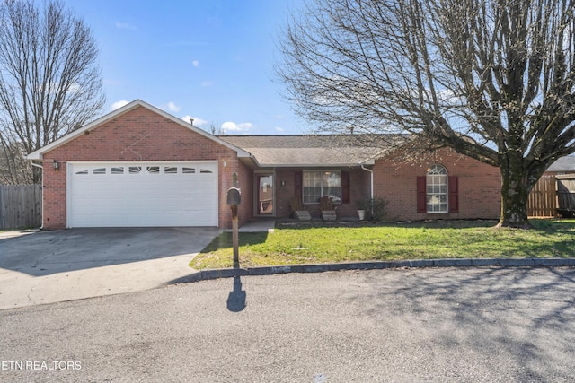 single story home featuring brick siding, a front lawn, fence, concrete driveway, and an attached garage