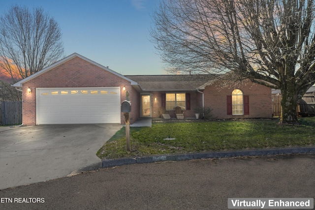 ranch-style house with fence, driveway, a front lawn, a garage, and brick siding