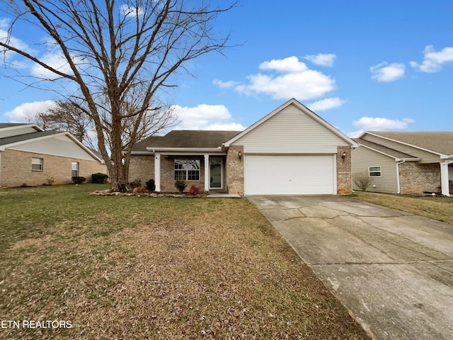 ranch-style home featuring a garage, a front yard, concrete driveway, and brick siding