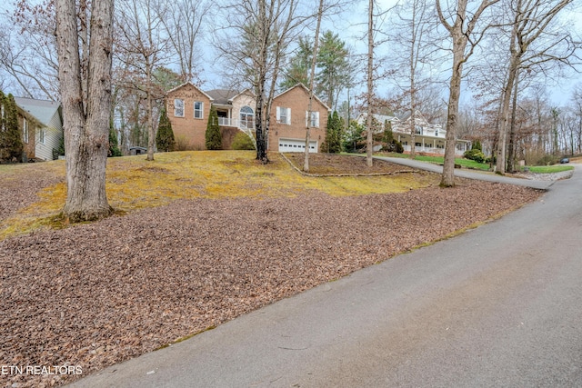 view of front facade featuring a residential view and brick siding