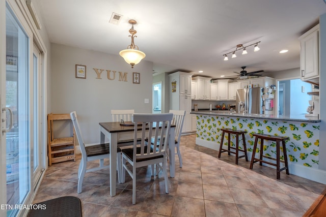 tiled dining area featuring baseboards, visible vents, ceiling fan, and recessed lighting