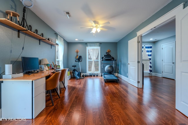 office with ceiling fan, dark wood finished floors, visible vents, and baseboards