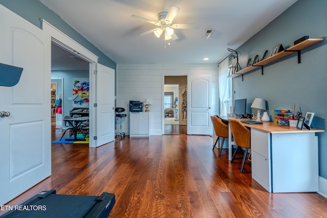 home office featuring visible vents, ceiling fan, and wood finished floors