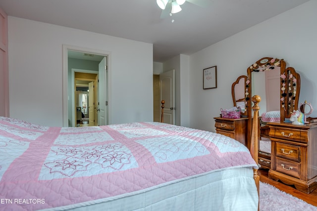 bedroom with a ceiling fan and wood finished floors