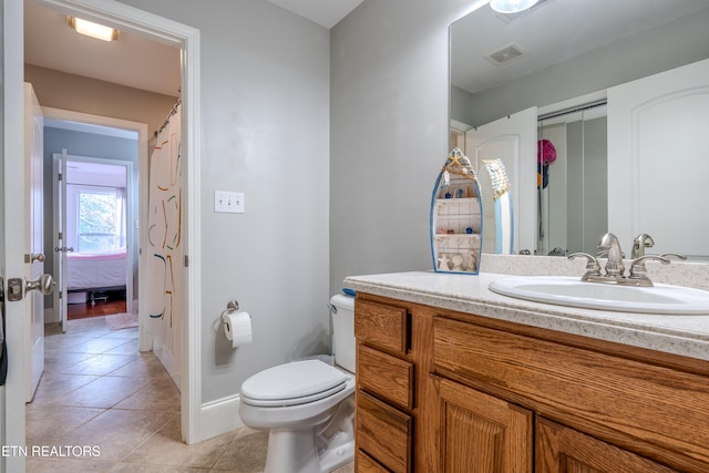 full bath featuring baseboards, visible vents, toilet, tile patterned floors, and vanity