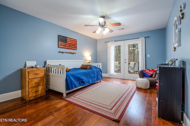 bedroom with access to exterior, french doors, visible vents, wood finished floors, and baseboards