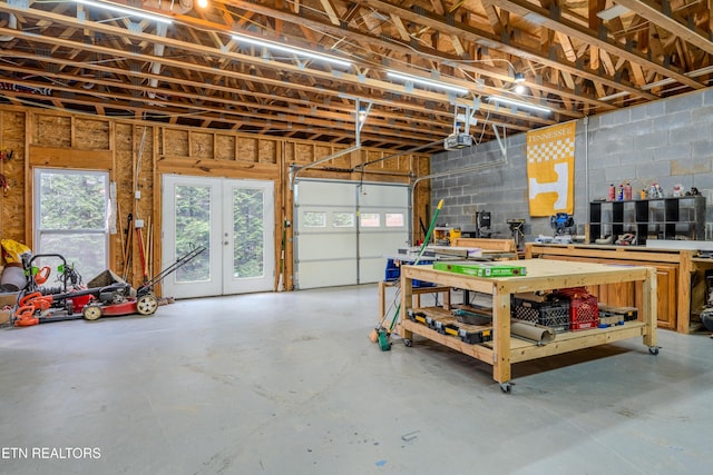 garage with french doors and a garage door opener