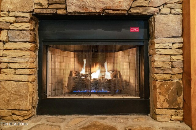 interior details with a warm lit fireplace