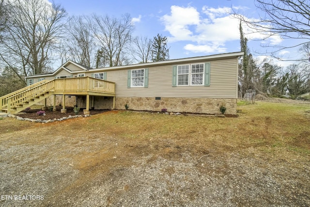 view of front of house featuring stairs, a deck, and crawl space