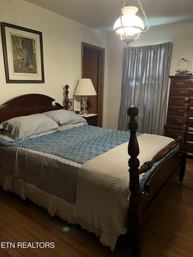 bedroom featuring wood-type flooring