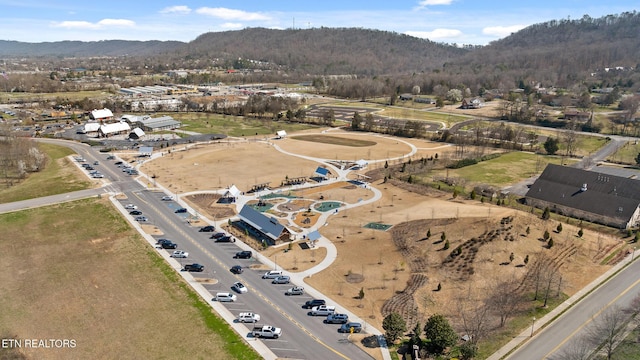 drone / aerial view featuring a mountain view