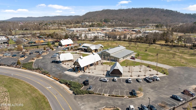 drone / aerial view featuring a mountain view