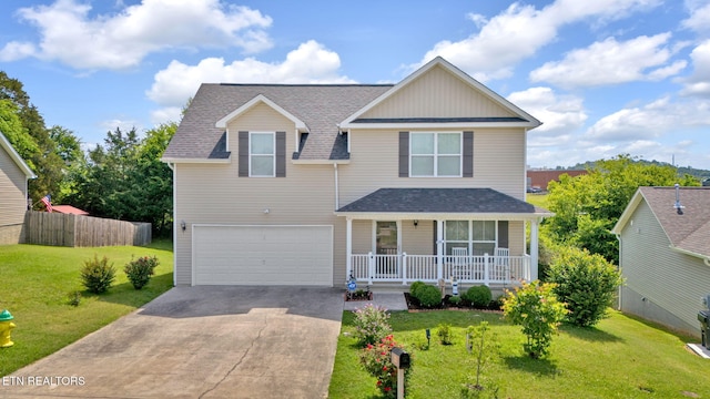 traditional-style house with driveway, a porch, a front lawn, and an attached garage