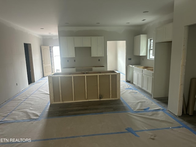 kitchen featuring white cabinets and a center island