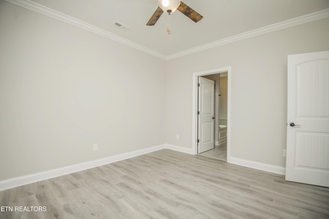 unfurnished room featuring baseboards, crown molding, a ceiling fan, and wood finished floors