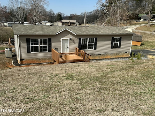 view of front of house featuring a deck, crawl space, and a front yard