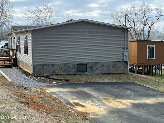 view of property exterior with crawl space