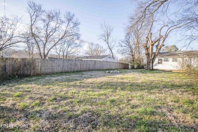 view of yard with a fenced backyard