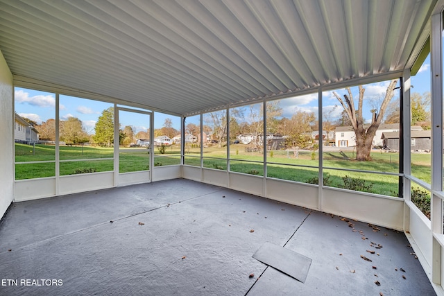unfurnished sunroom featuring a residential view