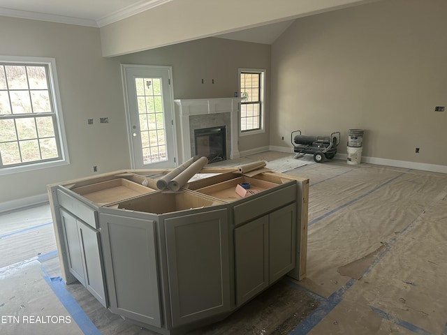 kitchen featuring baseboards and a wealth of natural light