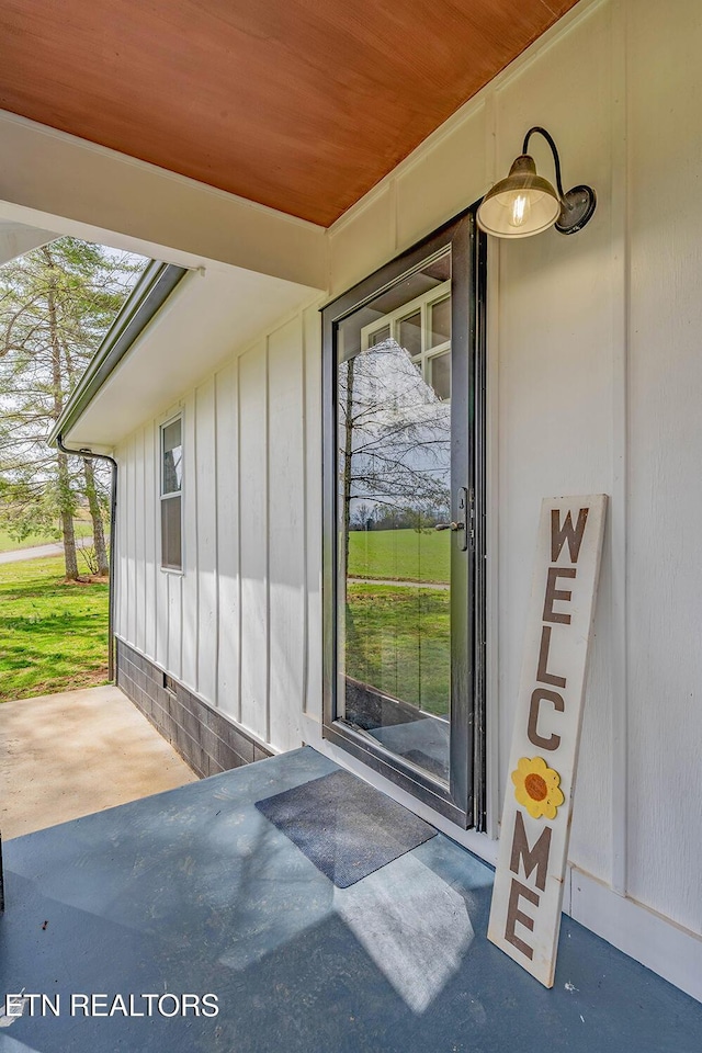 doorway to property with board and batten siding