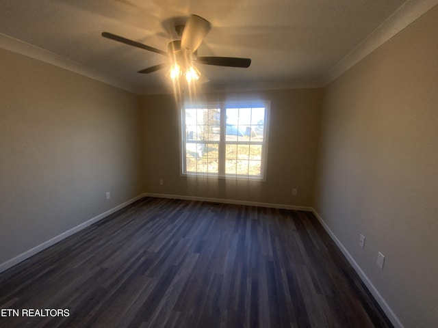 empty room featuring ceiling fan, baseboards, dark wood-style flooring, and crown molding