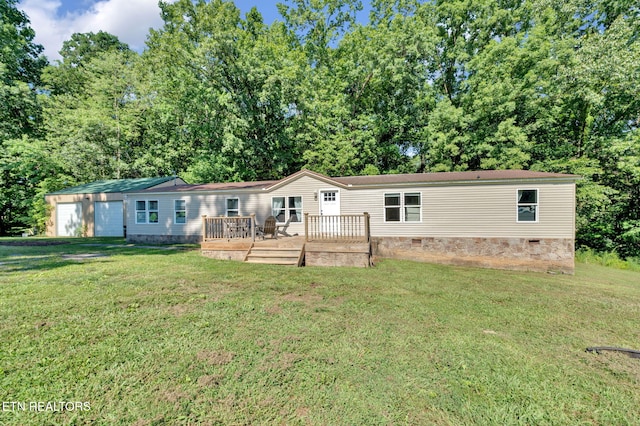 manufactured / mobile home with crawl space, a wooden deck, and a front lawn