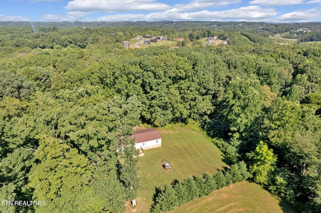 drone / aerial view with a view of trees