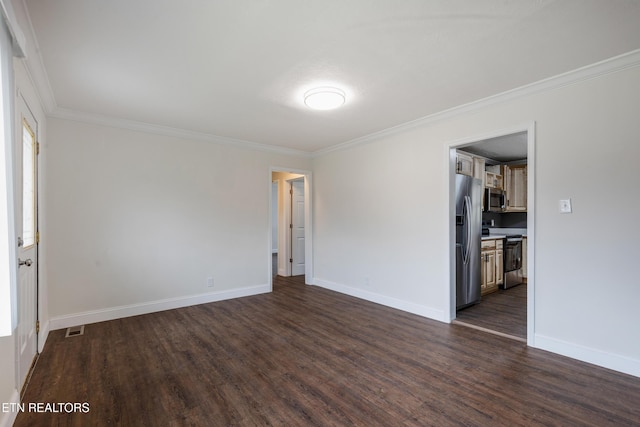 unfurnished room with ornamental molding, dark wood-style flooring, visible vents, and baseboards