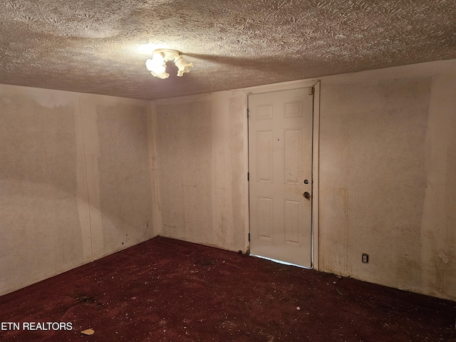 spare room featuring a textured ceiling