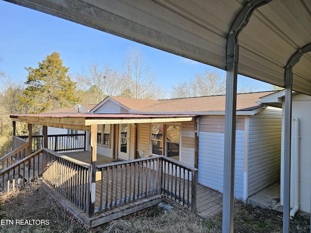 view of front of property featuring covered porch and roof with shingles