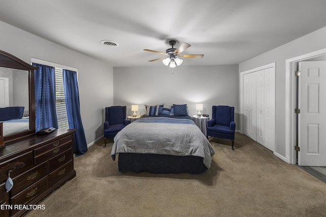 bedroom featuring ceiling fan, visible vents, baseboards, a closet, and carpet