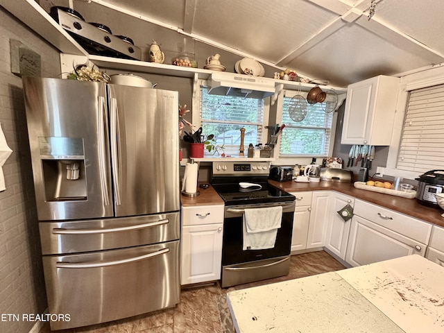 kitchen featuring under cabinet range hood, stainless steel appliances, white cabinetry, vaulted ceiling, and dark countertops