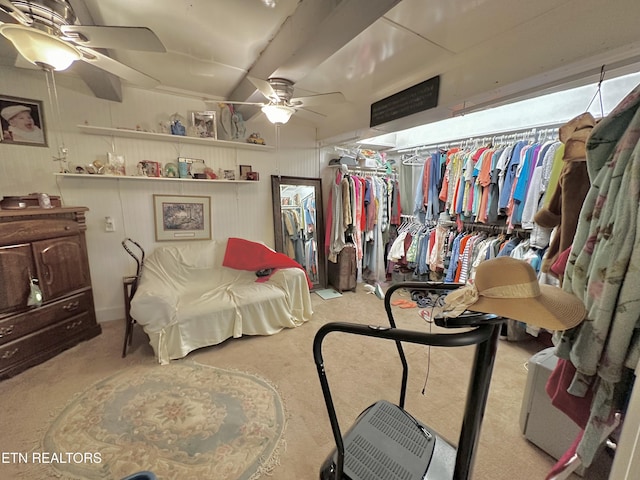 interior space with carpet floors and a ceiling fan