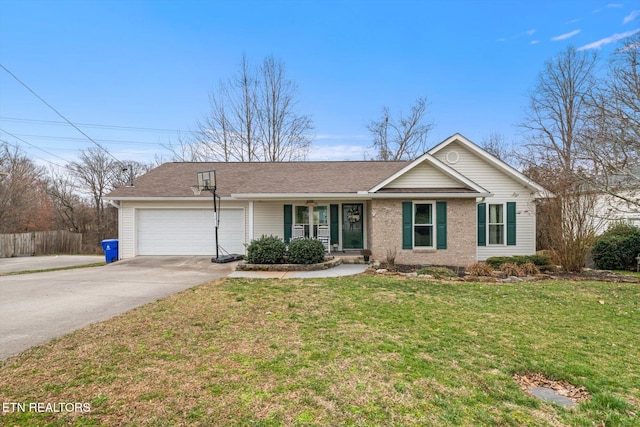 ranch-style home with a garage, concrete driveway, a front lawn, and brick siding