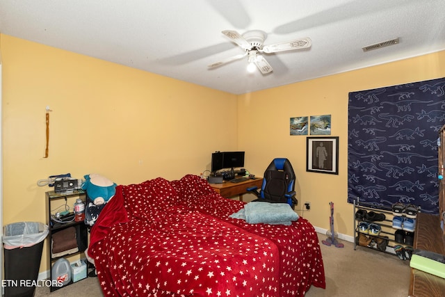 bedroom featuring visible vents, baseboards, carpet, and ceiling fan