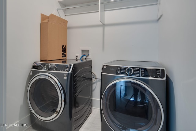 laundry area featuring laundry area and independent washer and dryer