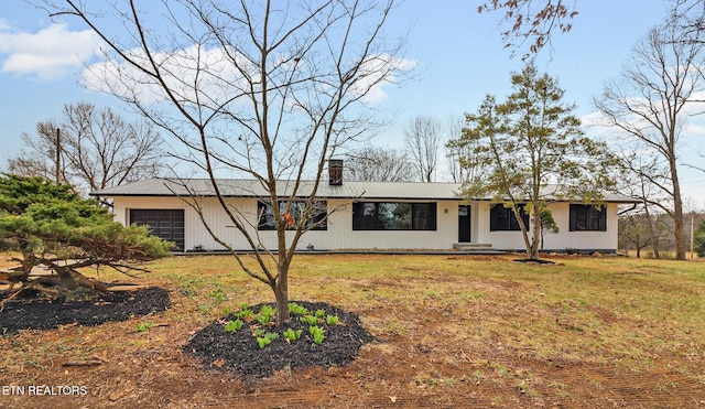 212 Copenhaver Rd, Lenoir City, TN 37771 - ranch-style house with a chimney, metal roof, a front yard, and a garage