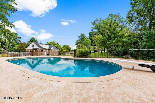 view of swimming pool featuring a fenced in pool, a patio area, and fence