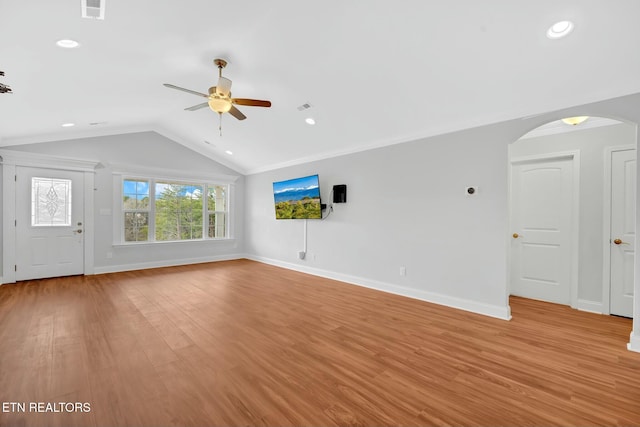 unfurnished living room featuring arched walkways, light wood finished floors, lofted ceiling, visible vents, and a ceiling fan