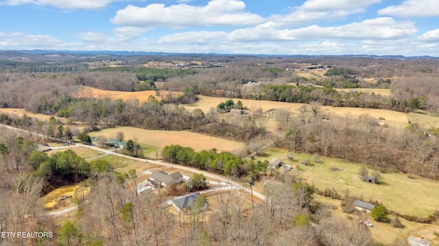 birds eye view of property with a rural view