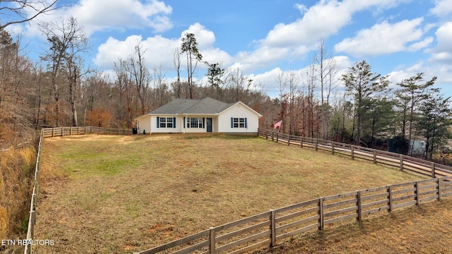 view of front of house with a front lawn and fence