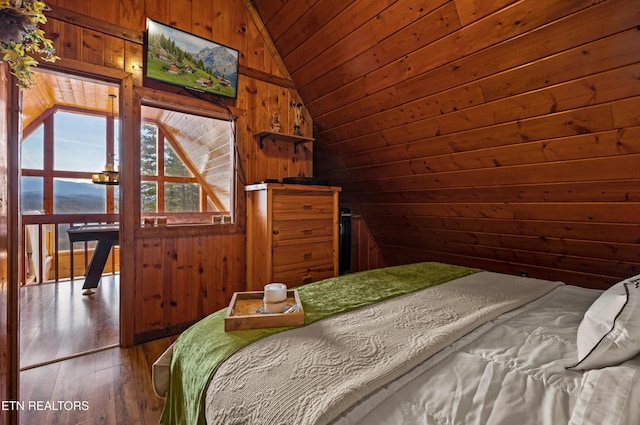 unfurnished bedroom featuring wooden ceiling, wood walls, vaulted ceiling, and hardwood / wood-style flooring