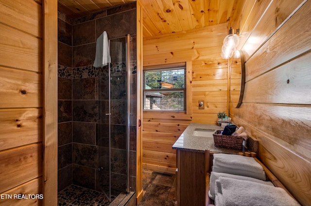 full bath featuring wooden walls, wood ceiling, a shower stall, and vanity