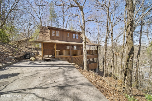 view of front facade featuring board and batten siding and covered porch