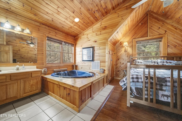 full bath with lofted ceiling, a garden tub, a ceiling fan, and wood walls