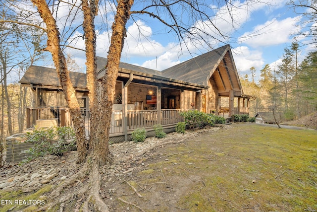 view of side of home featuring a yard