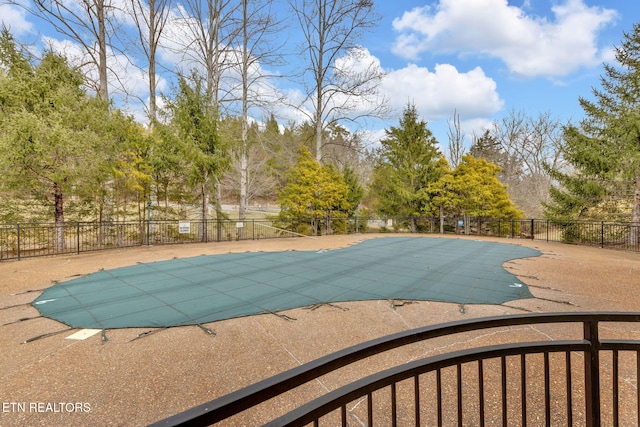 view of pool with a patio area, fence, and a fenced in pool